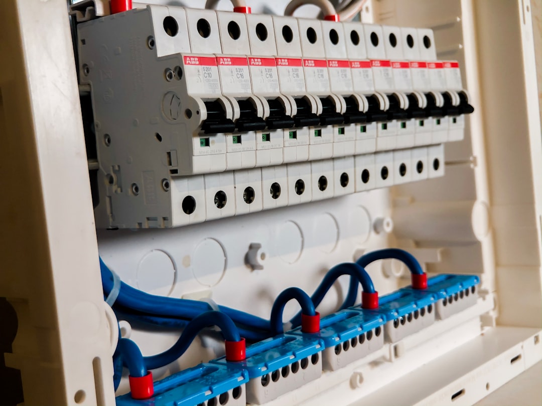 Blog 9 modern smart kitchen with high-tech appliances and electrical panel visible in background - is your electrical system safe