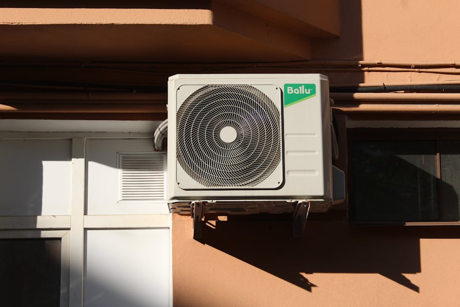Blog 12 noisy air conditioner homeowner listening concerned indoors - ac making strange noises what they mean